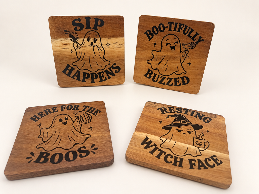 Actual four-piece ghost acacia coaster set on a clean background