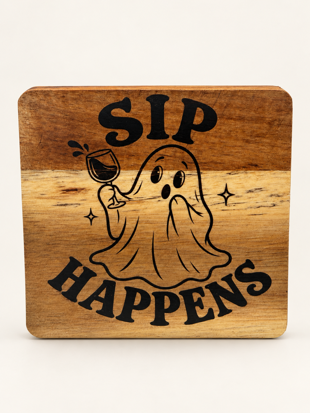 Actual Sip Happens engraved wood coaster on a clean background
